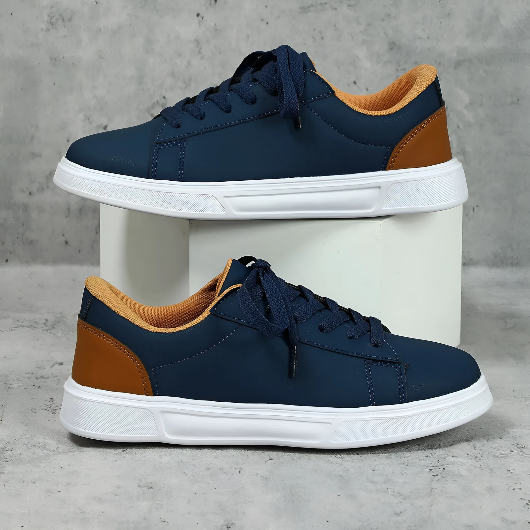 Beige brown platform skateboard sneakers with a cross-strap and round toe on a white background.