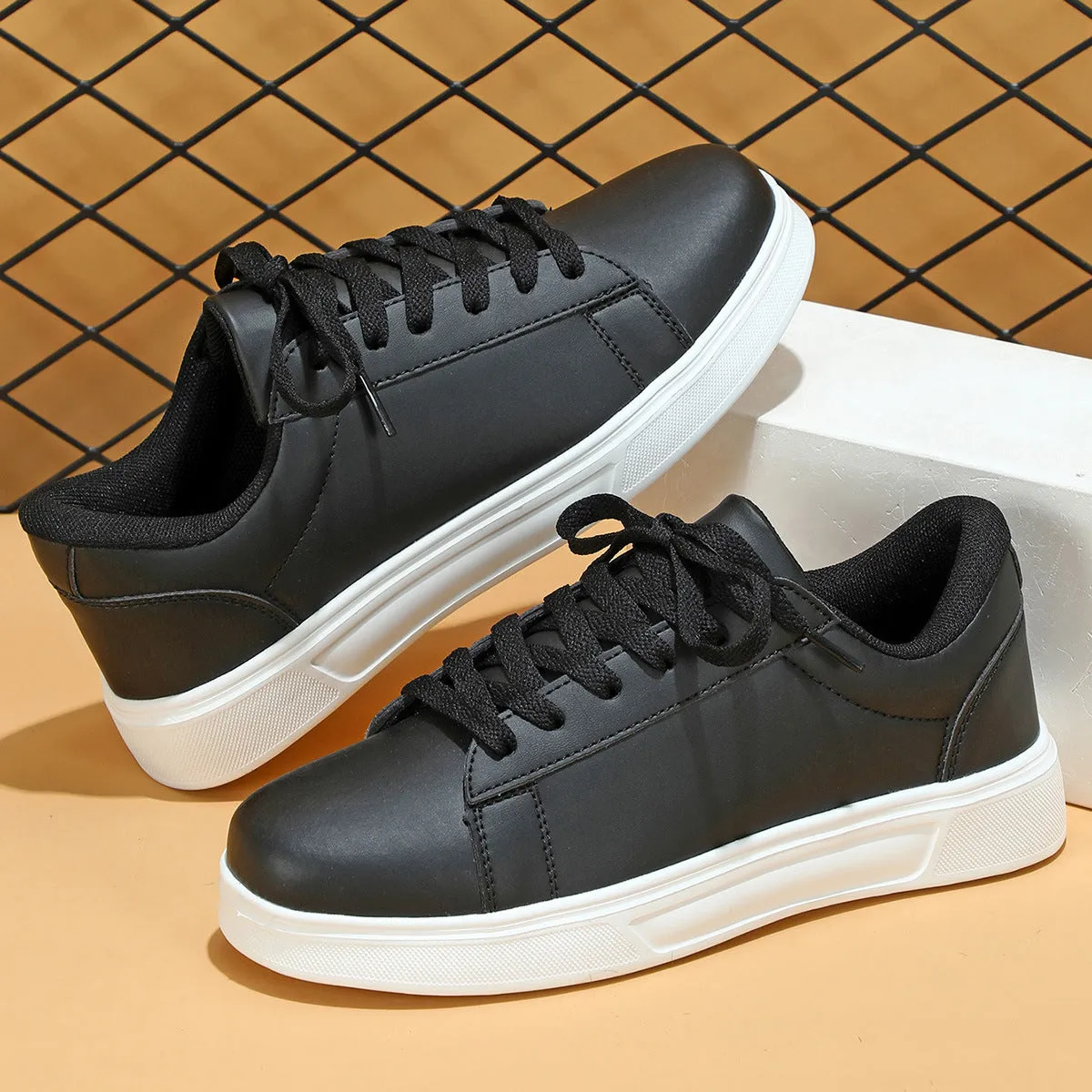Beige brown platform skateboard sneakers with a cross-strap and round toe on a white background.