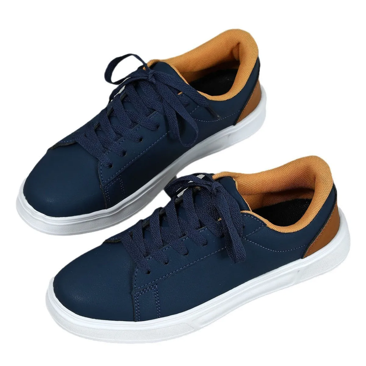 Beige brown platform skateboard sneakers with a cross-strap and round toe on a white background.