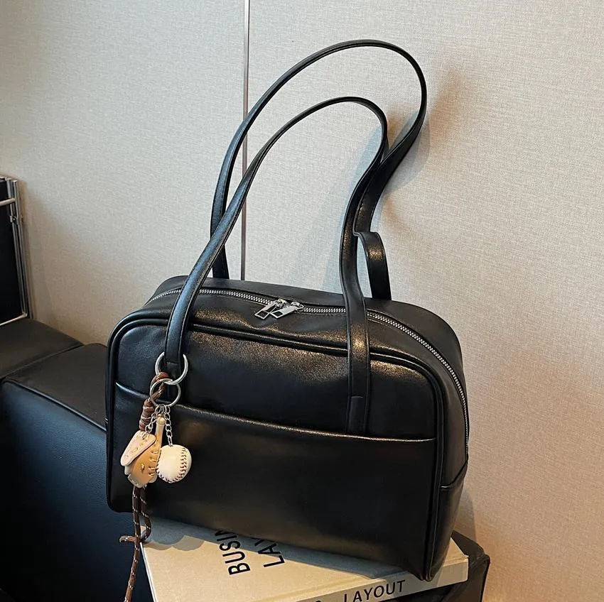 Women's urban simple PU bucket underarm bag with pendant detail in black, brown, coffee, and wine red colours.