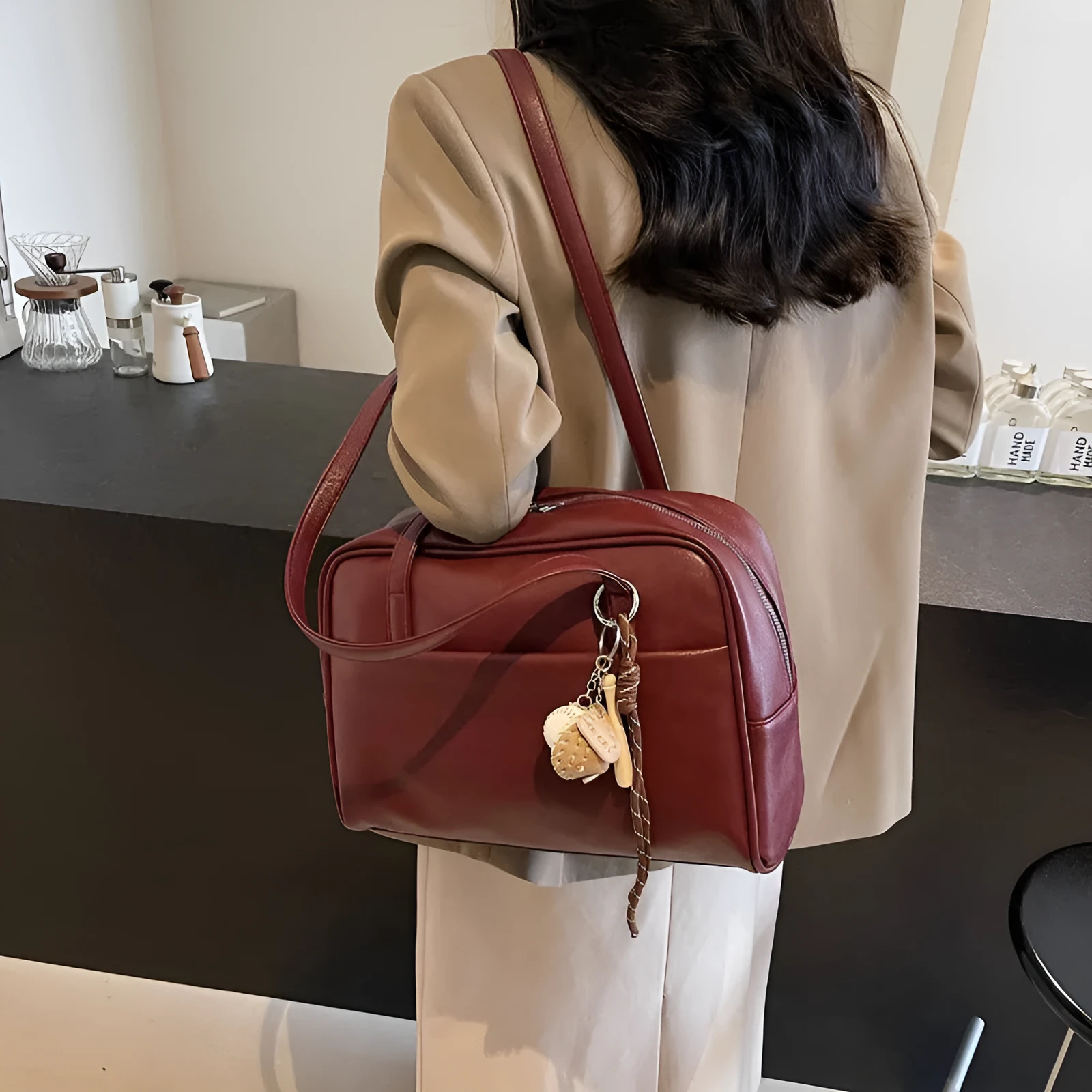 Women's urban simple PU bucket underarm bag with pendant detail in black, brown, coffee, and wine red colours.