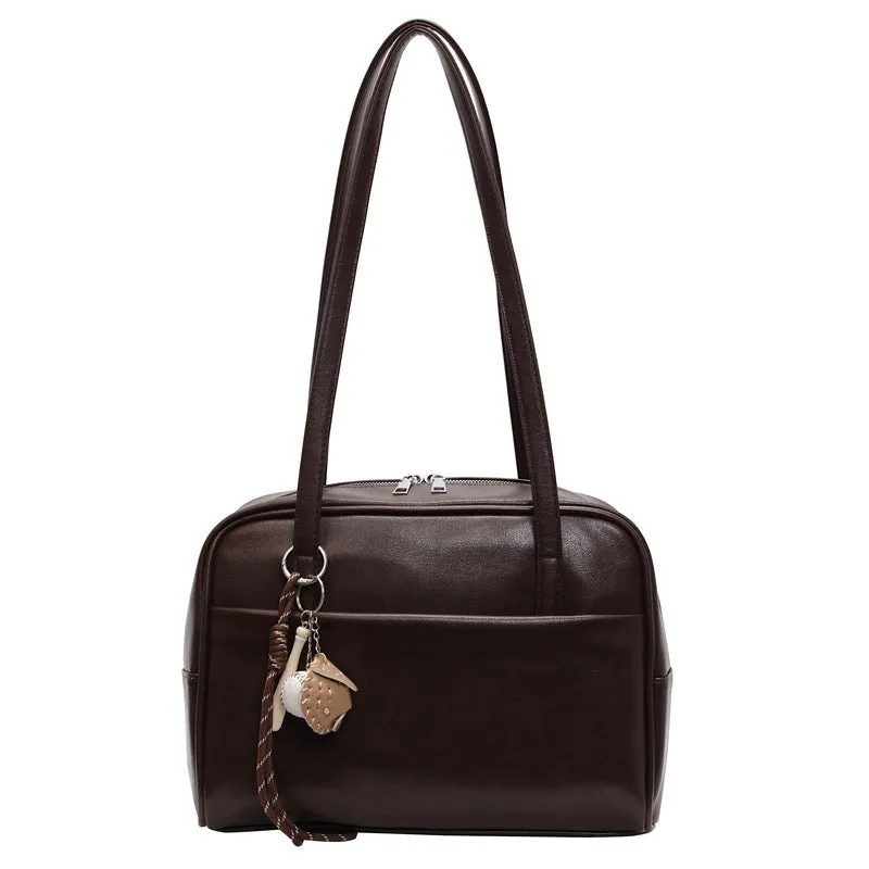 Women's urban simple PU bucket underarm bag with pendant detail in black, brown, coffee, and wine red colours.