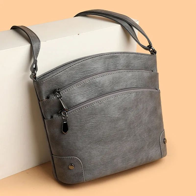 Large capacity multi-layer bucket bag in available colours including black, brown, and green