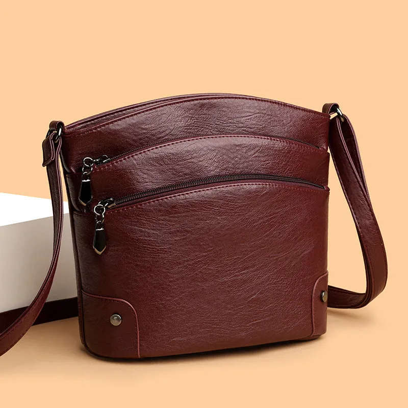 Large capacity multi-layer bucket bag in available colours including black, brown, and green