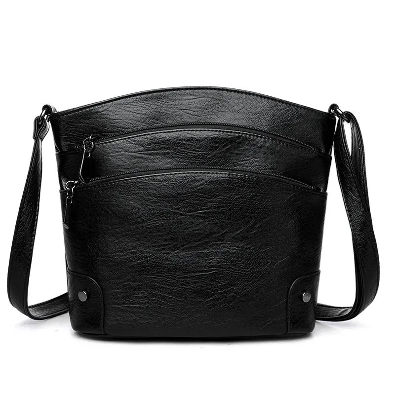 Large capacity multi-layer bucket bag in available colours including black, brown, and green