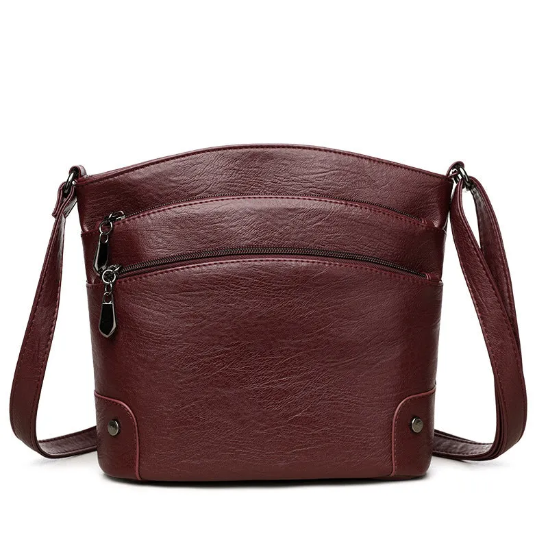 Large capacity multi-layer bucket bag in available colours including black, brown, and green
