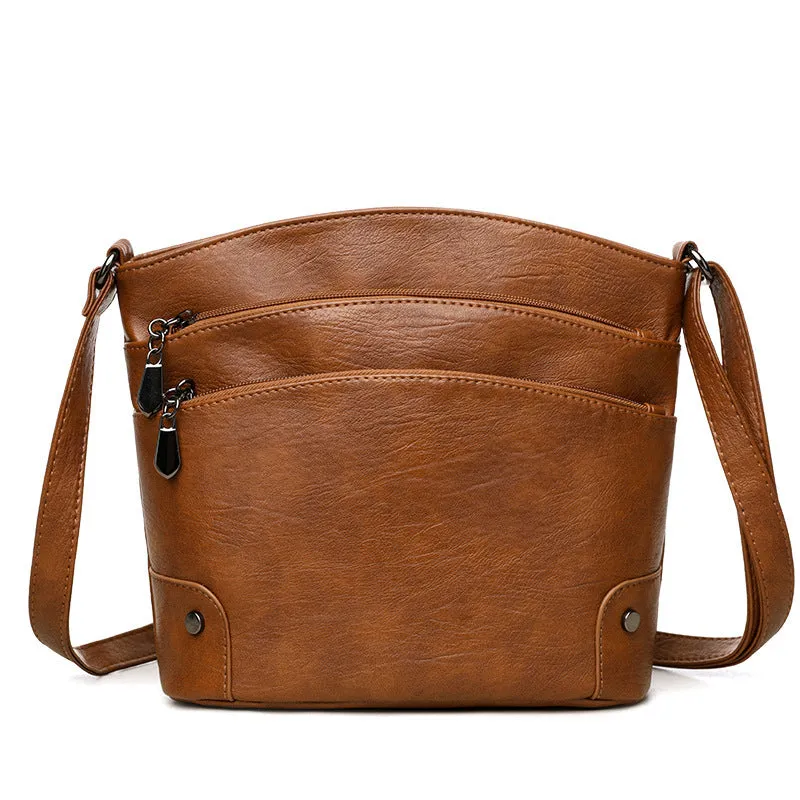 Large capacity multi-layer bucket bag in available colours including black, brown, and green