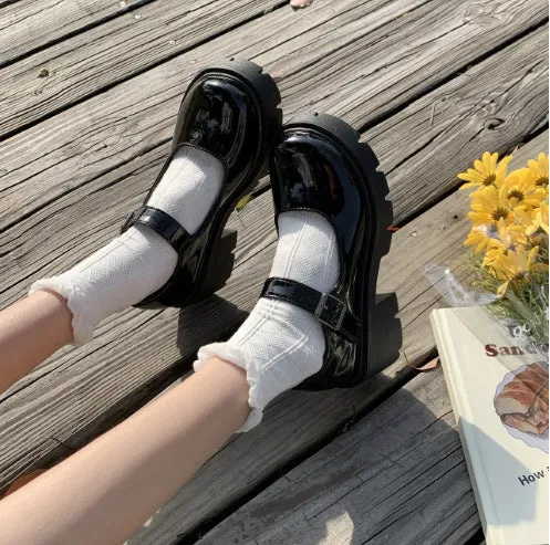 Women's buckle British style patent leather shoes in beige with round toe and low top, side view