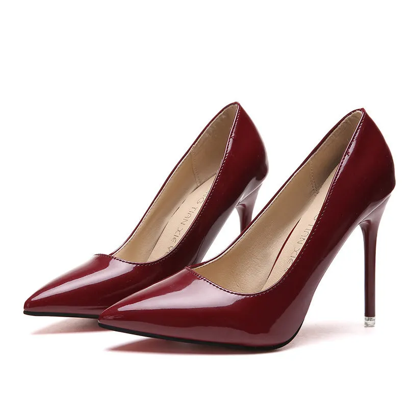 Women's pointed toe stiletto high heel pumps in apricot colour with a chunky heel and buckle detail.
