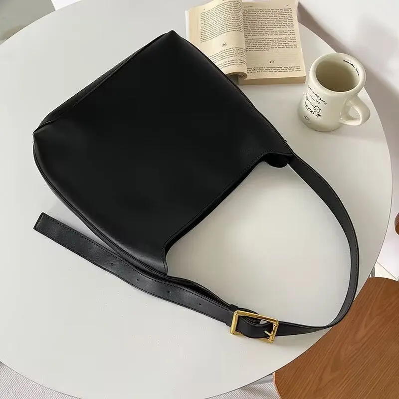 Women's soft PU shoulder bag with swing threads decoration showing black and brown colour options