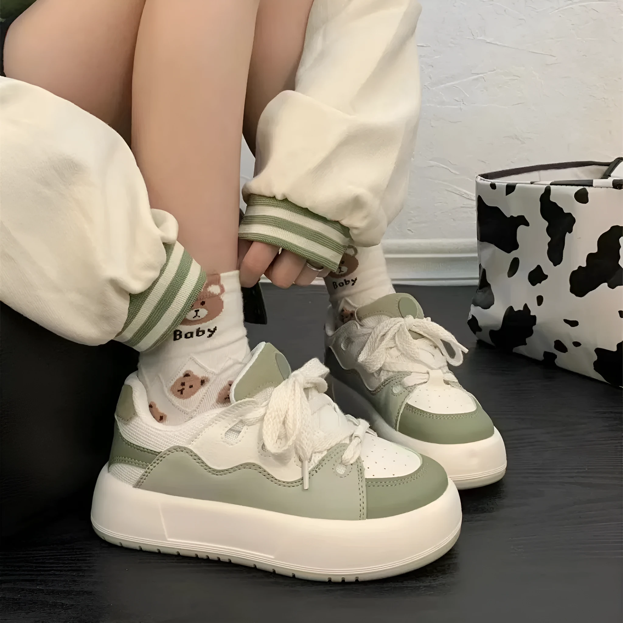 Green women's casual shoes with flat heel and round toe design showing pu mesh upper material