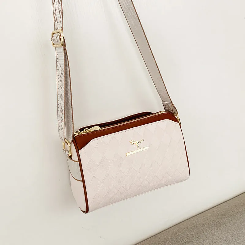 Soft PU leather crossbody messenger bag in black with visible sewing thread detail and single shoulder strap