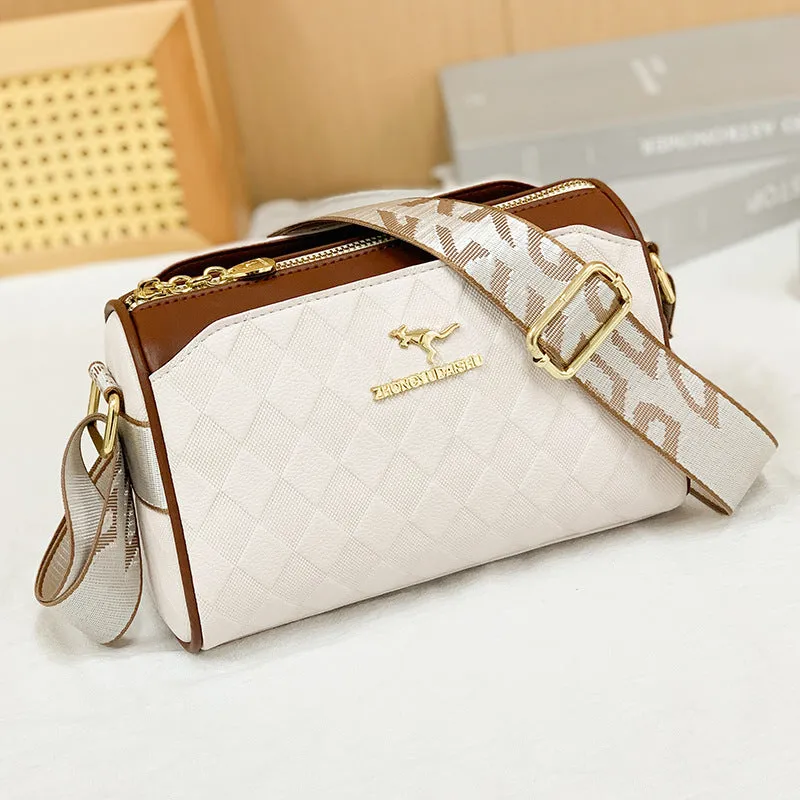 Soft PU leather crossbody messenger bag in black with visible sewing thread detail and single shoulder strap
