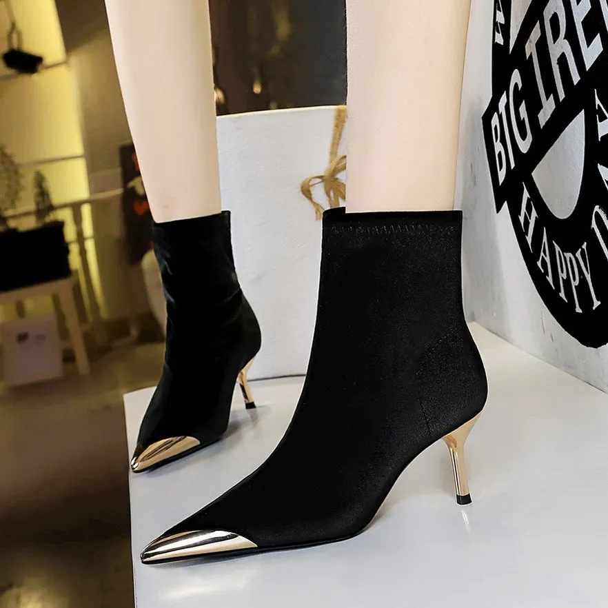 Women's suede stiletto heel ankle boots in black with pointed toe and metal detail
