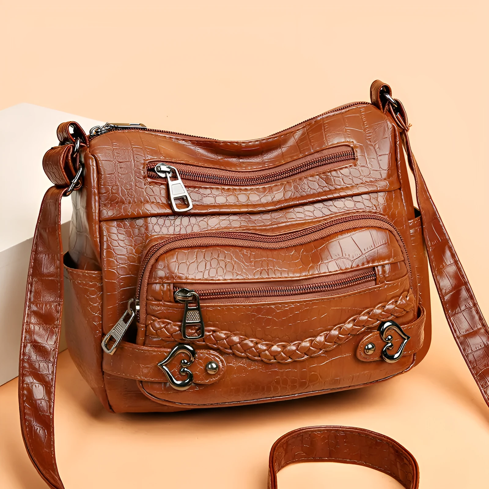 Large capacity knitted messenger bag in brown with PU leather trim, zip closure, and outer pocket, 23x11x17cm