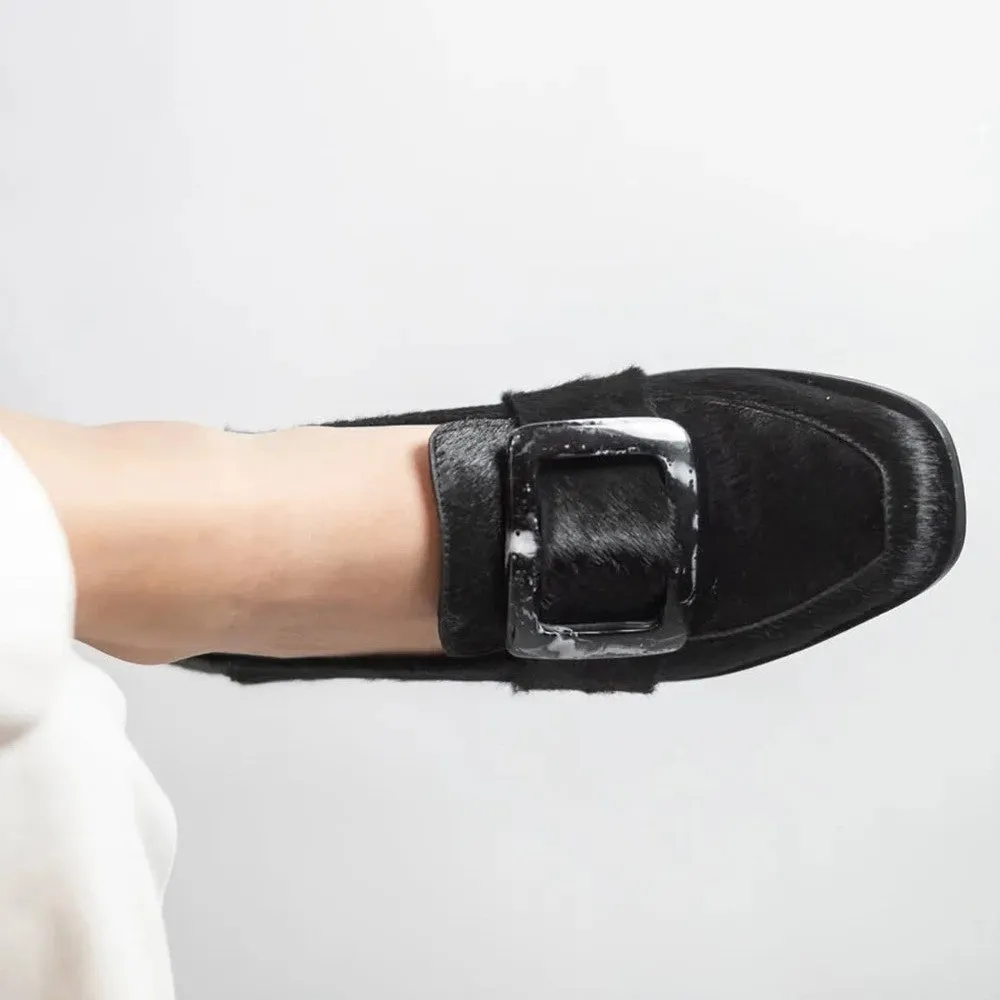 Low-cut black loafers for women with large square button and rhinestone details, round toe, low heel