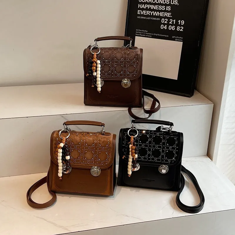 Small square PU leather messenger backpack for women with texture finish in black colour