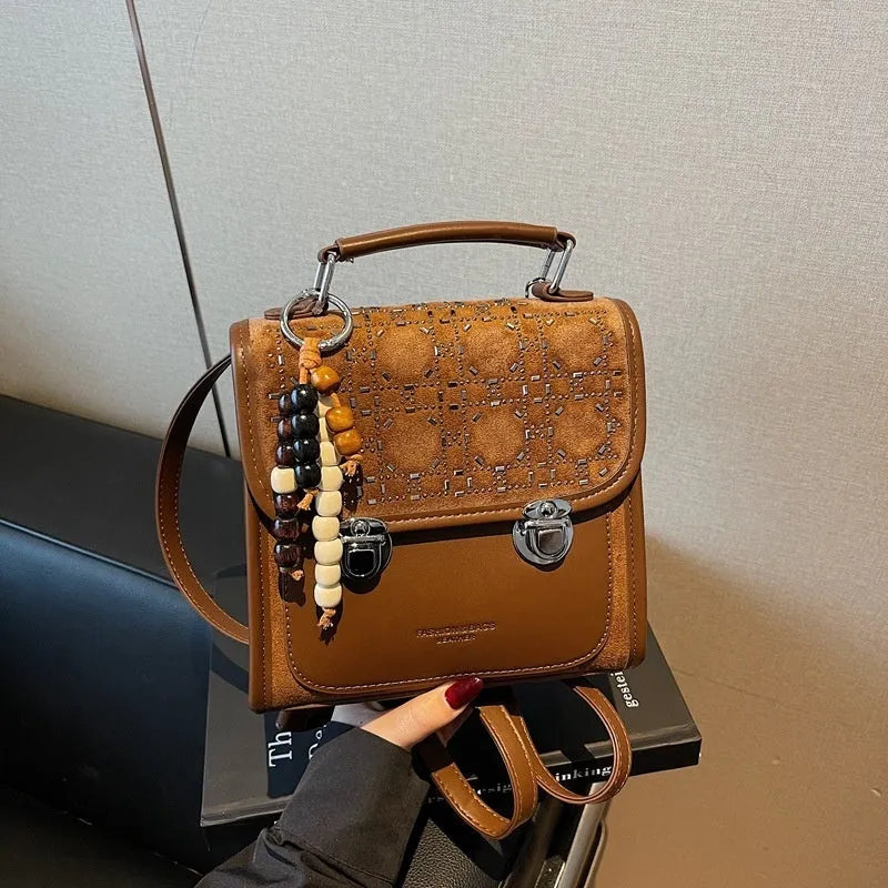 Small square PU leather messenger backpack for women with texture finish in black colour