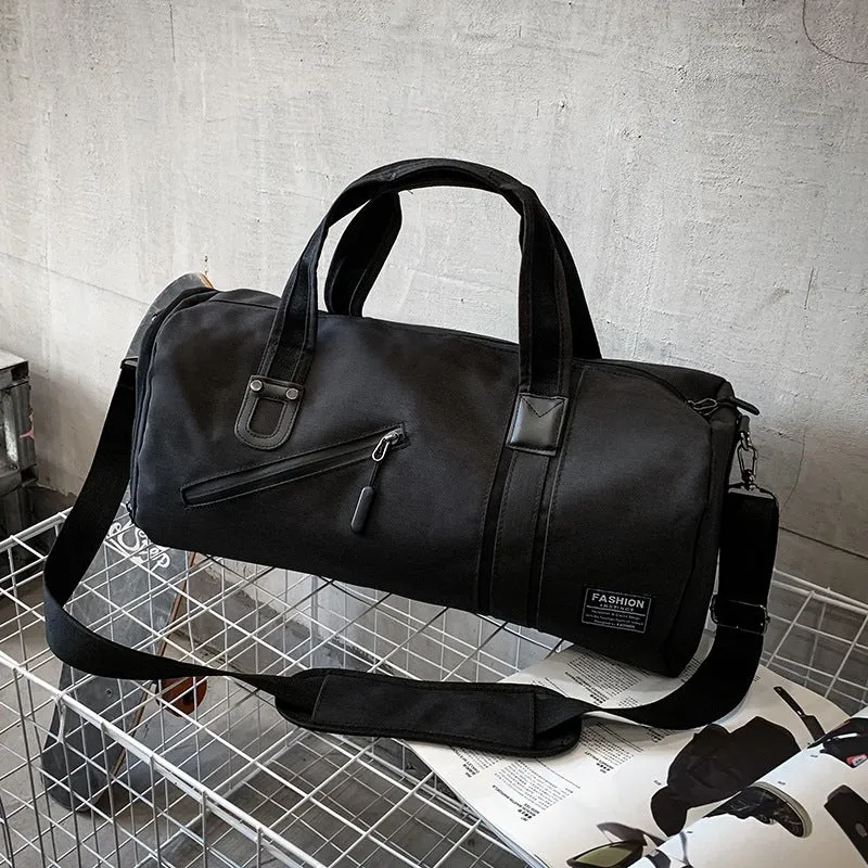 Cylindrical wet and dry sports gym bag in black with polyester texture and zippered pockets
