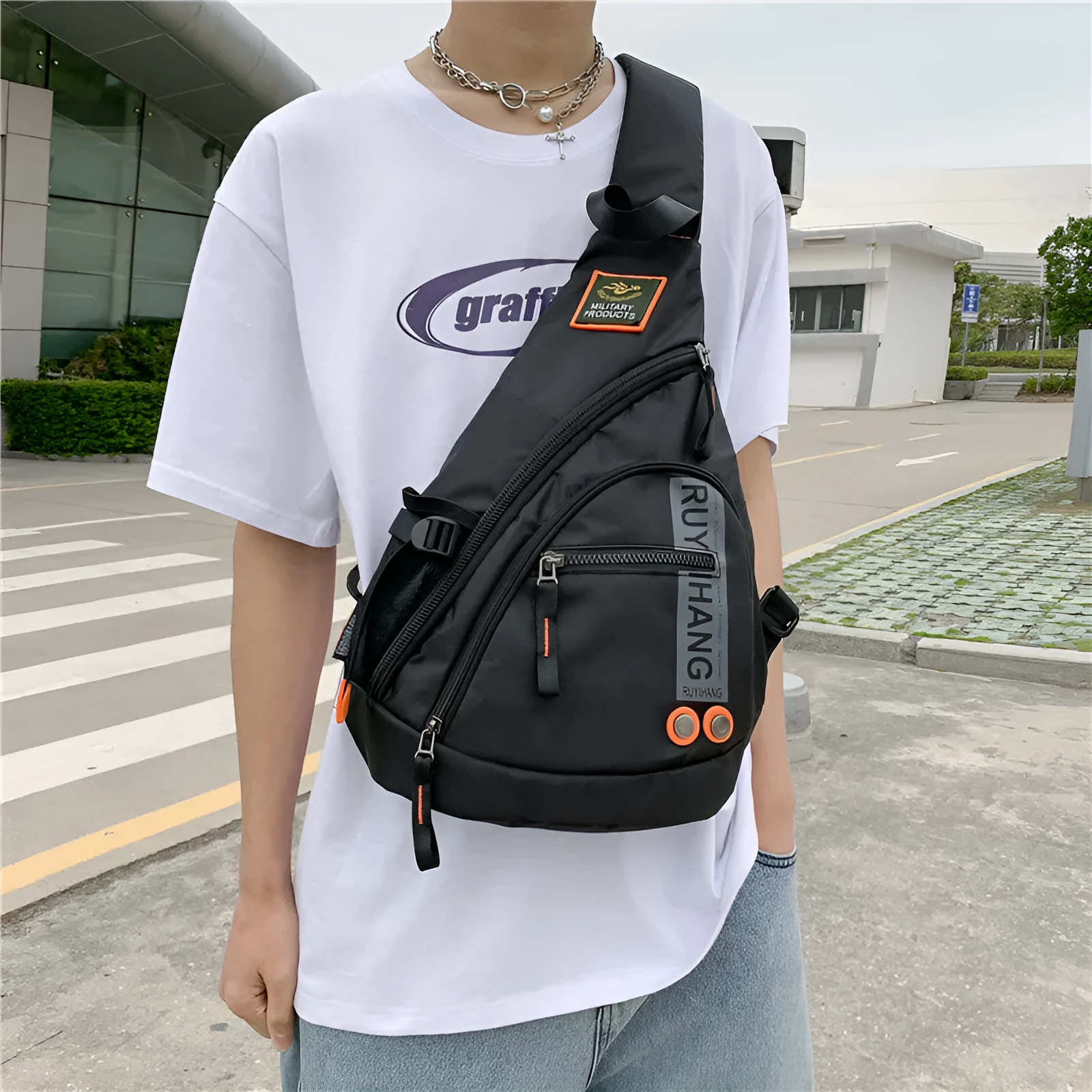 Unisex outdoor large capacity nylon chest bag in black with ventilation slots and adjustable strap