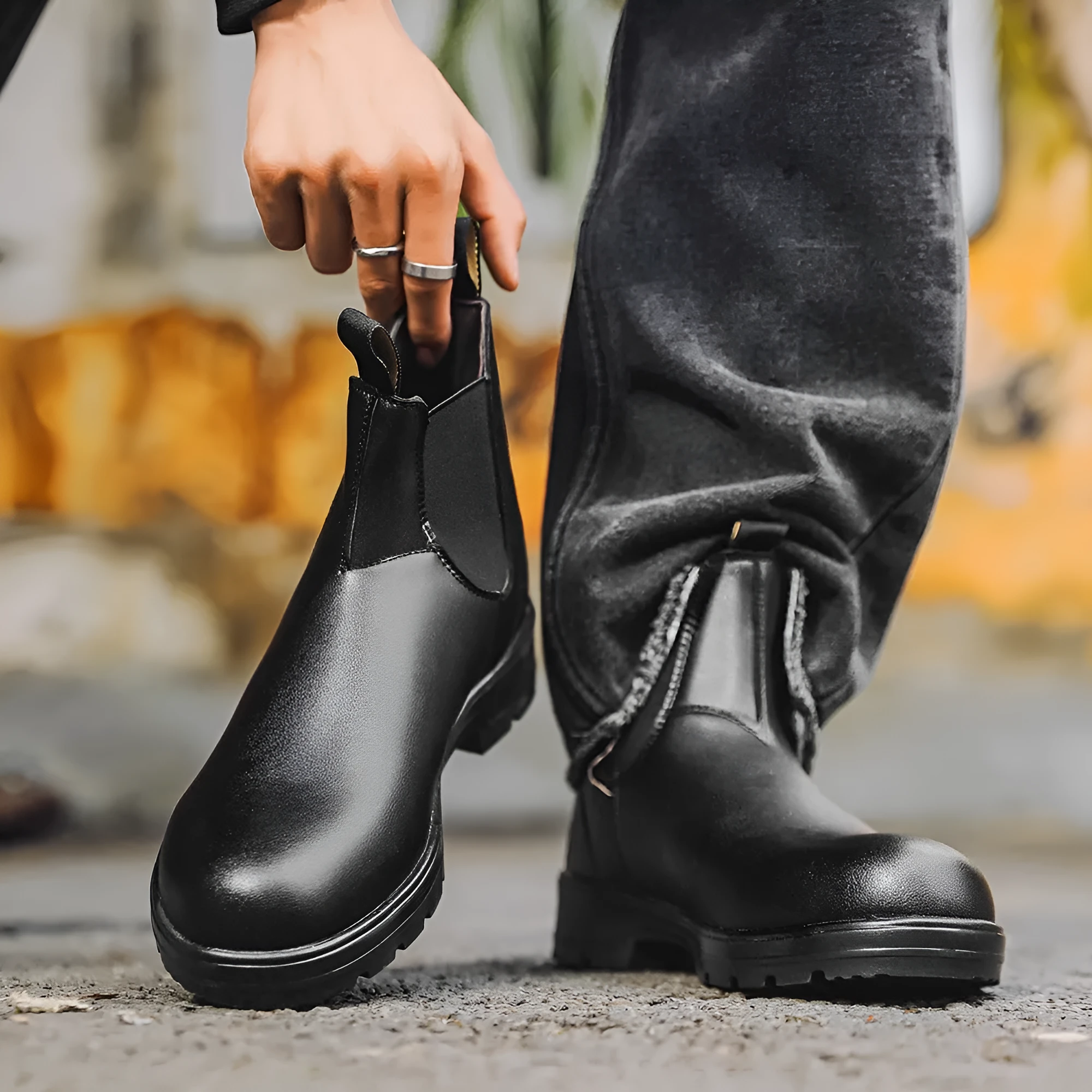 Vintage brown unisex Chelsea boots with car stitching and a low horse hoof heel.