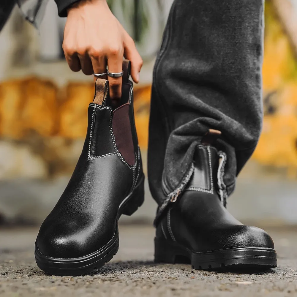 Vintage brown unisex Chelsea boots with car stitching and a low horse hoof heel.
