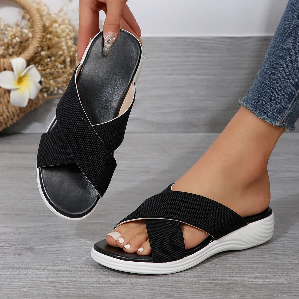 Black romantic style women's wedge slippers with cross strap and thick rubber sole