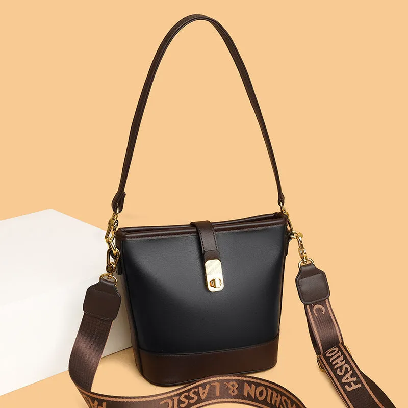 Korean-style black bucket messenger bag with double shoulder straps showing internal organiser compartments