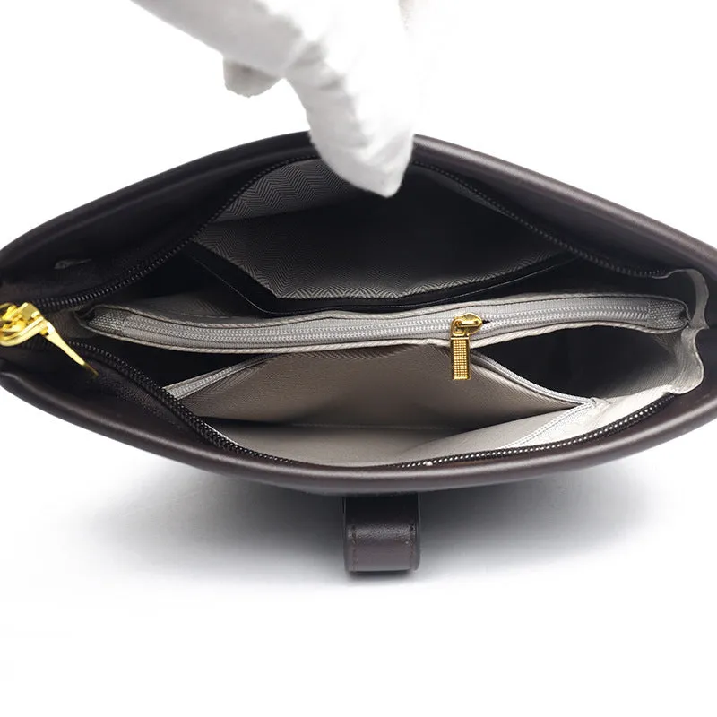 Korean-style black bucket messenger bag with double shoulder straps showing internal organiser compartments