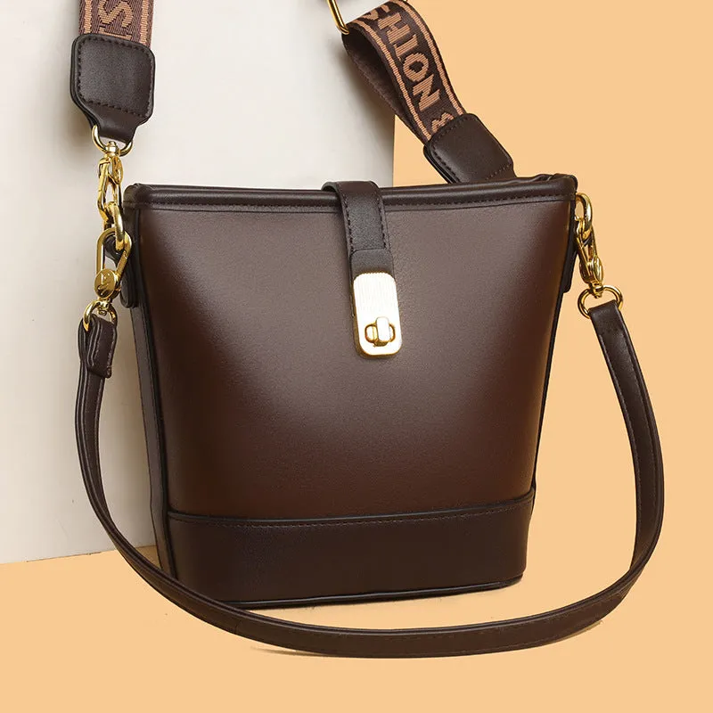 Korean-style black bucket messenger bag with double shoulder straps showing internal organiser compartments