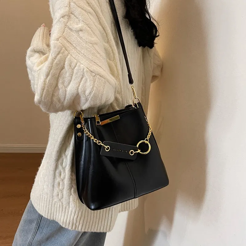 Large capacity PU shoulder bag with wide strap in black colour, sewing thread detail, crossbody style