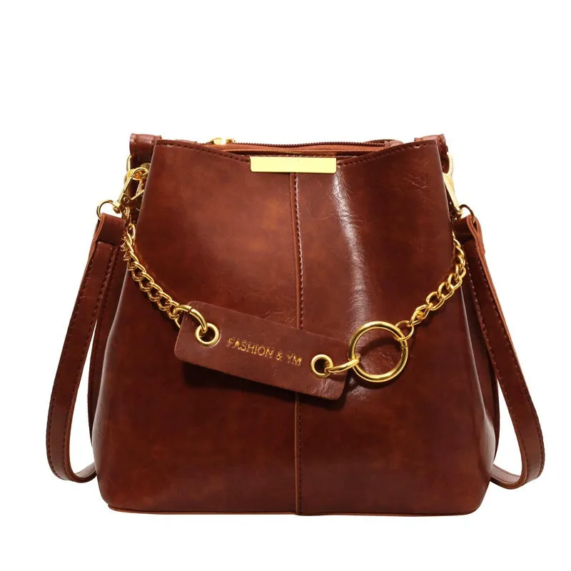 Large capacity PU shoulder bag with wide strap in black colour, sewing thread detail, crossbody style