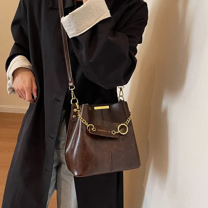 Large capacity PU shoulder bag with wide strap in black colour, sewing thread detail, crossbody style