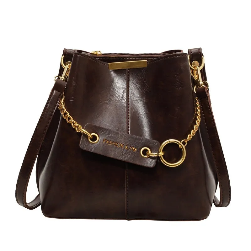 Large capacity PU shoulder bag with wide strap in black colour, sewing thread detail, crossbody style