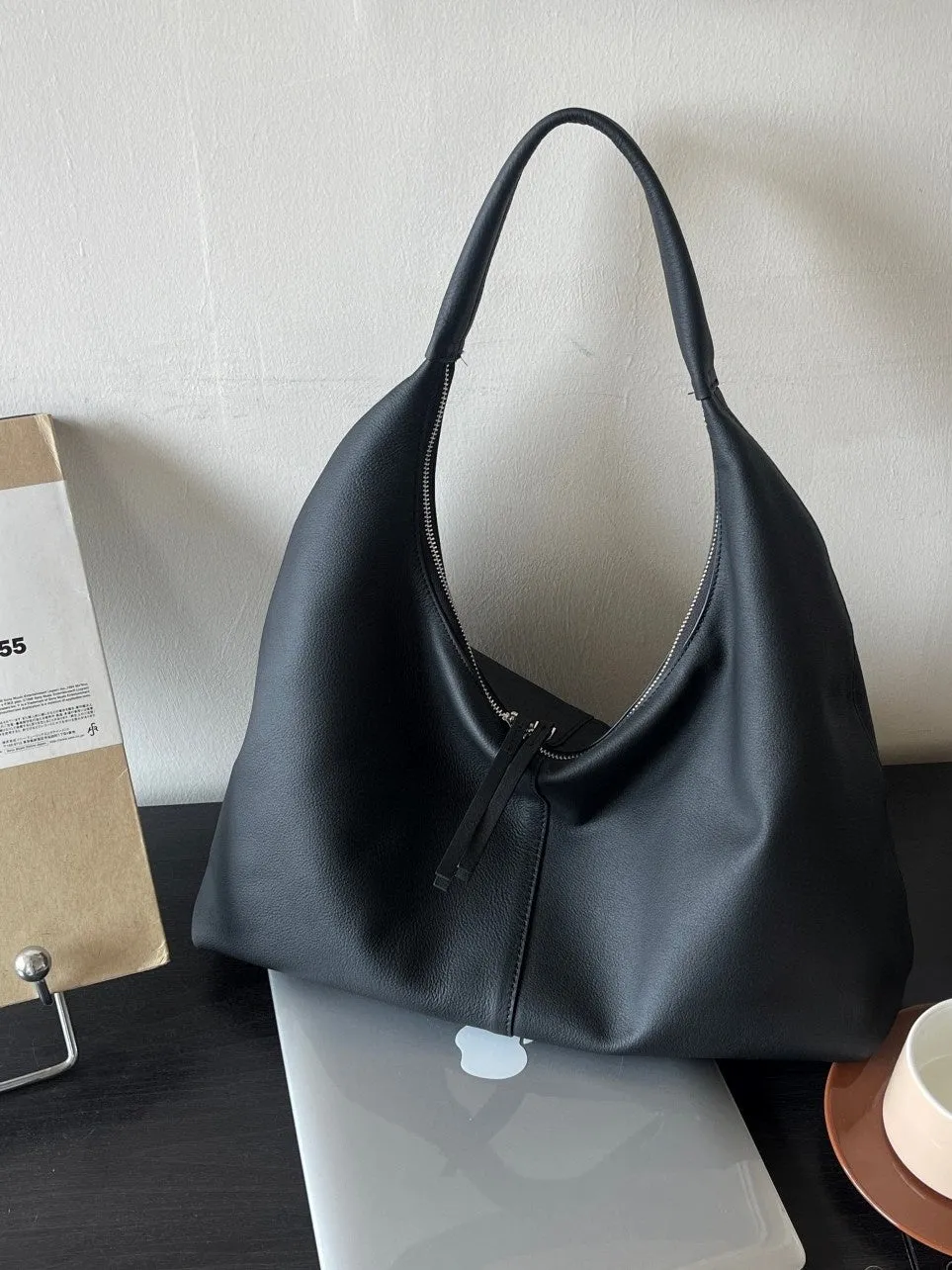 Genuine leather crescent underarm bag in ankarat red with sandwich pocket and single shoulder strap