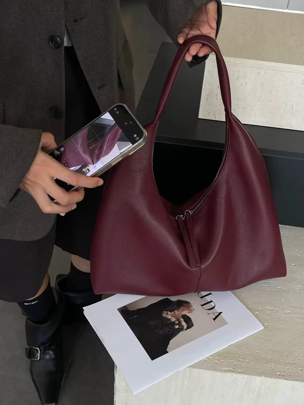 Genuine leather crescent underarm bag in ankarat red with sandwich pocket and single shoulder strap