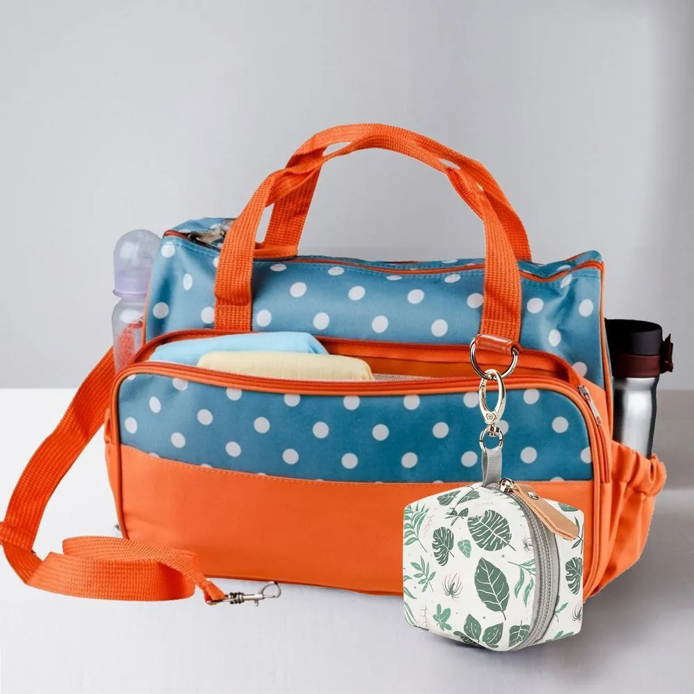 Baby pacifier holder case in PU leather with impervious nylon lining and buckle clip, holds 2 pacifiers, compact 6.35cm size