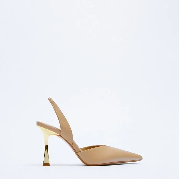 Women's pointed patent leather high heels in apricot colour on a white background.