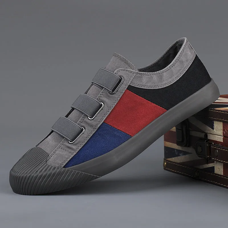 Men's canvas sneakers with rubber sole in multiple colour options showing low top design and elastic band