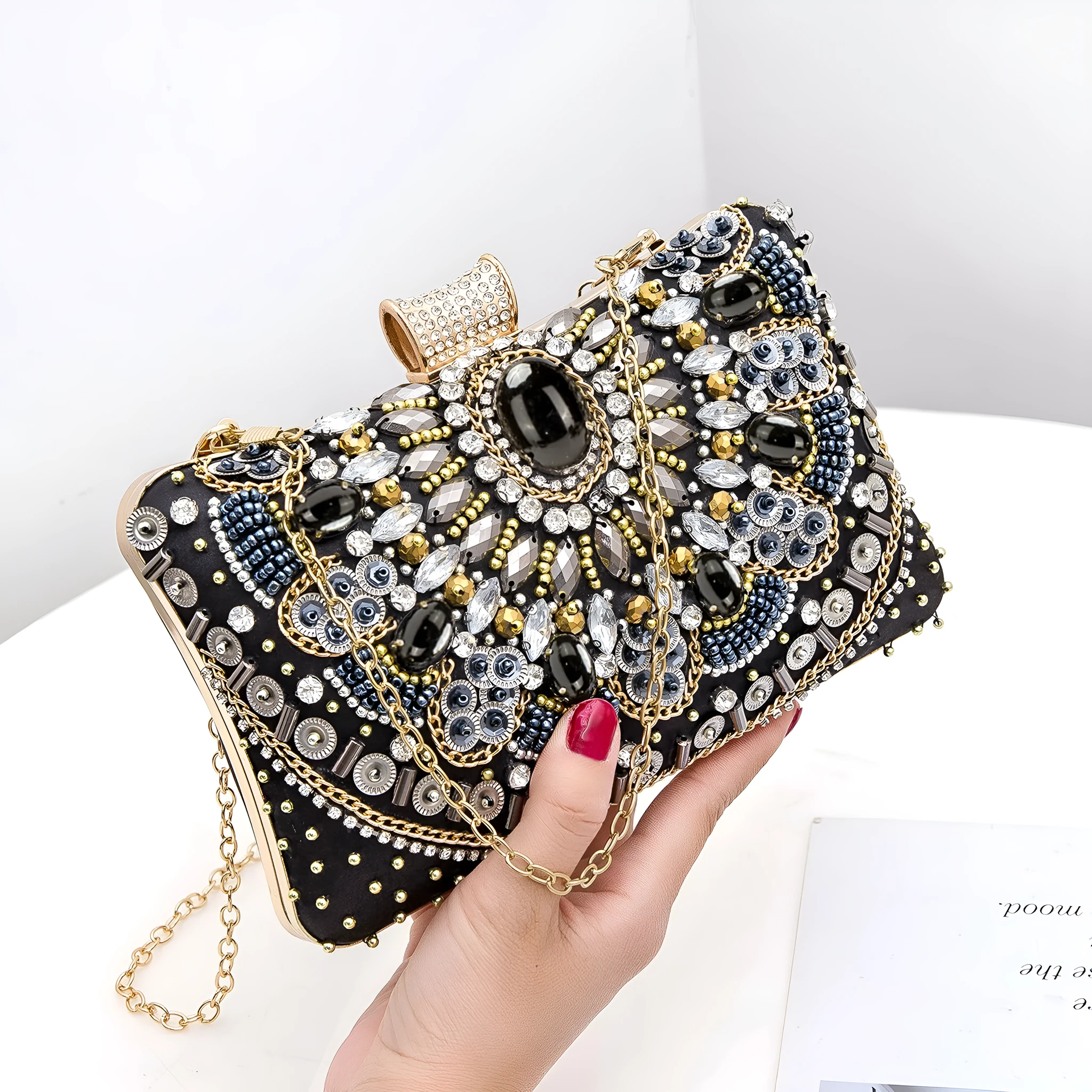 Retro hard shell dinner bag with pearl embroidery and beading in white, showing three-dimensional pocket and hand-held design
