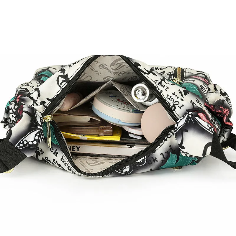 Graffiti casual crossbody bag in nylon with sewing line and print details, medium-soft build, single strap, dumpling shape