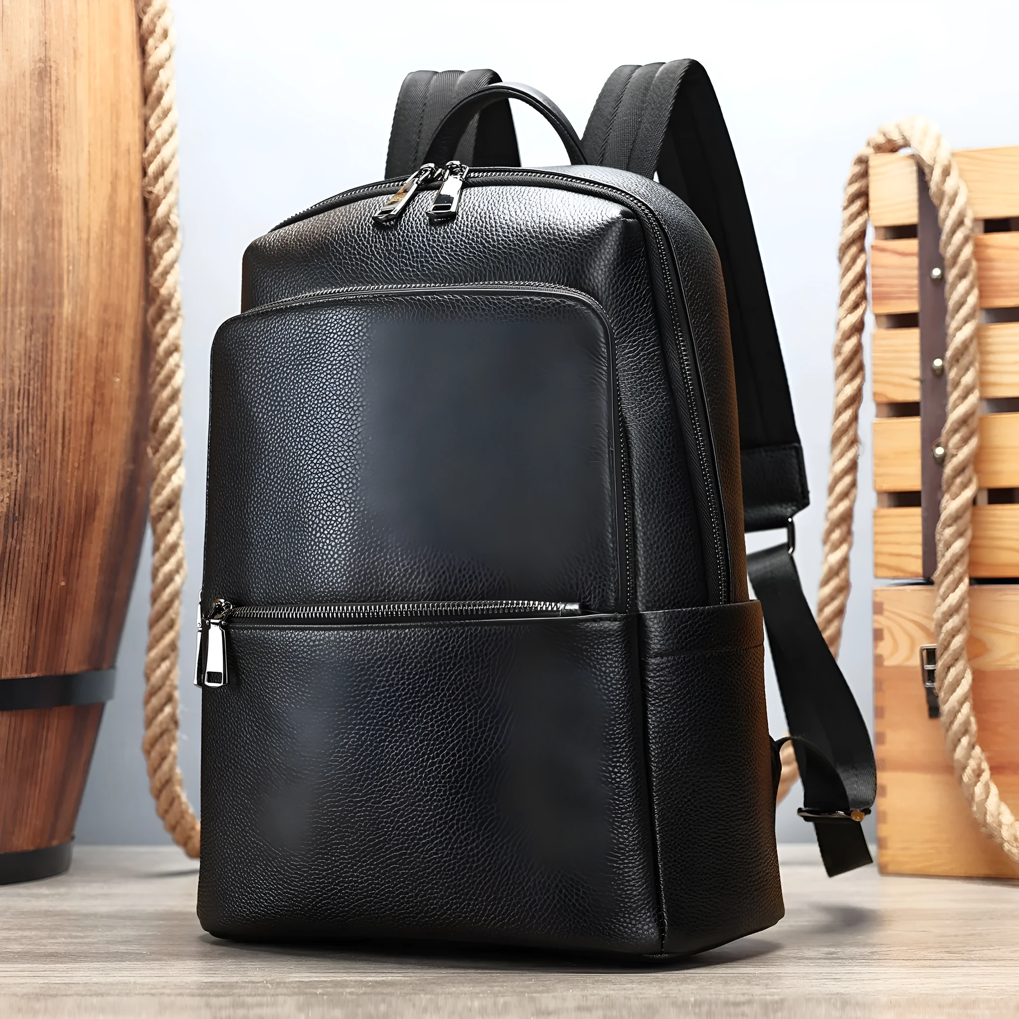 Men's genuine leather backpack in black, first layer cowhide, with a top handle and zipped main compartment