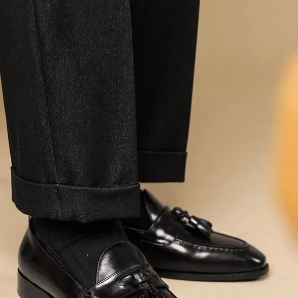 Men's polished leather tassel loafers in black and brown with pigskin lining and rubber sole