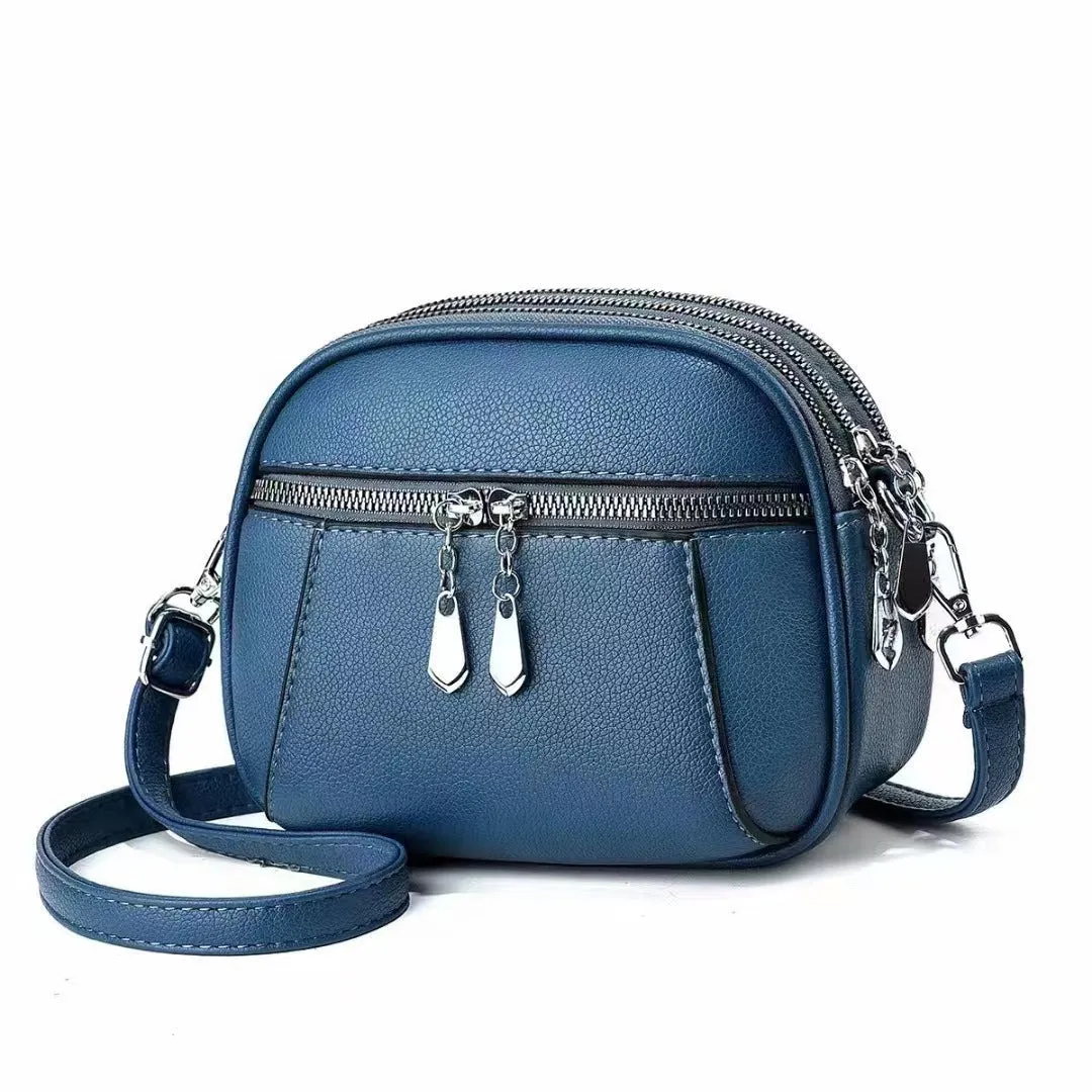 Solid colour small round bag with stitch detailing and zip closure, in multiple colours