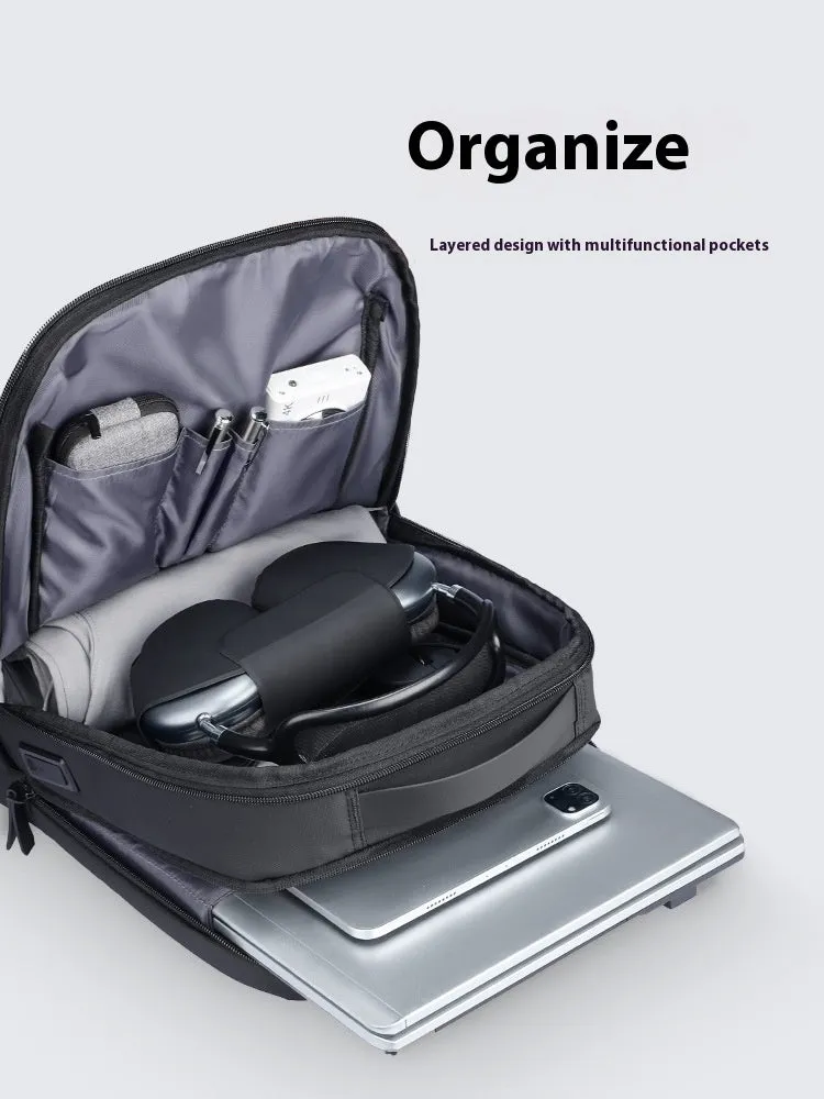 Graphite grey USB business backpack with Oxford cloth exterior showing charging port and under 20L capacity