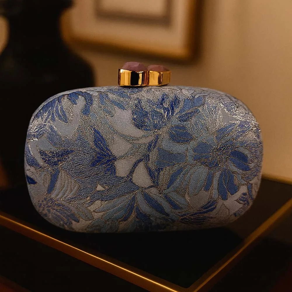 Ladies hard shell oval clutch bag in PU leather with open pocket shown in blue