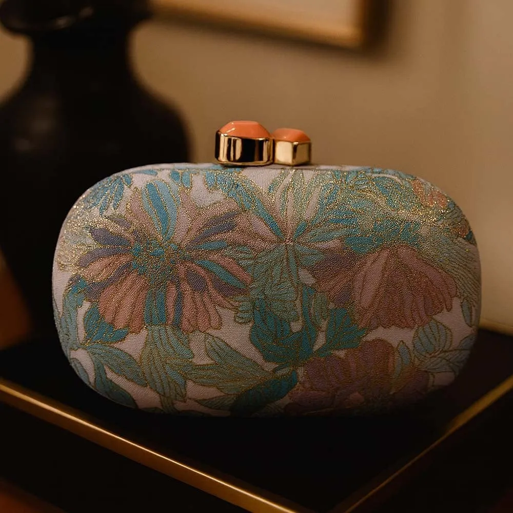 Ladies hard shell oval clutch bag in PU leather with open pocket shown in blue