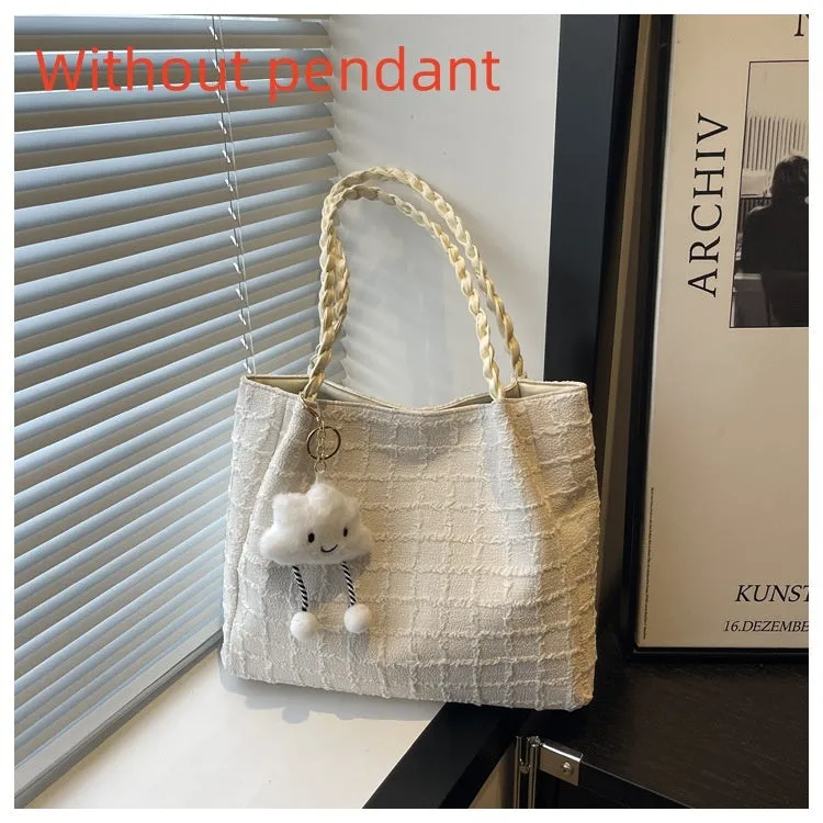 Women's canvas shoulder messenger bag large bucket shape with magnetic clasp and phone pocket, available in black, blue, pink, white.