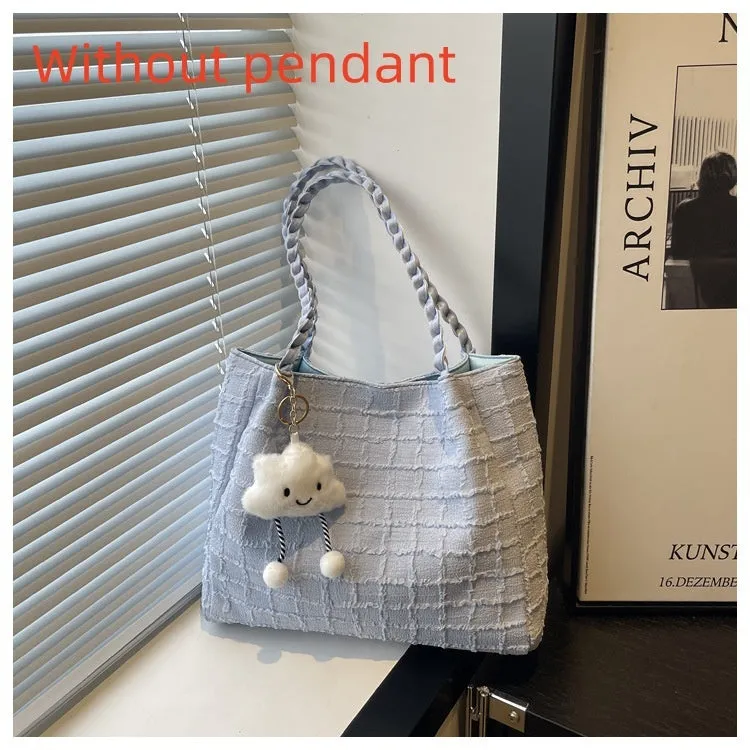 Women's canvas shoulder messenger bag large bucket shape with magnetic clasp and phone pocket, available in black, blue, pink, white.