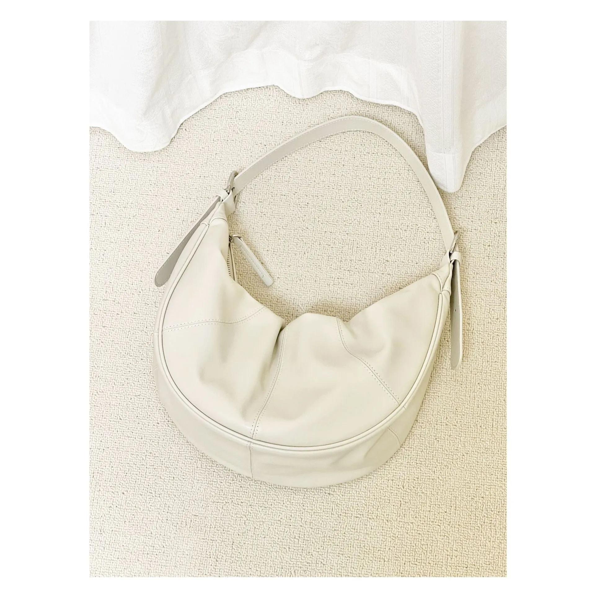 Women's black dumpling-shaped cowhide leather shoulder bag with double strap
